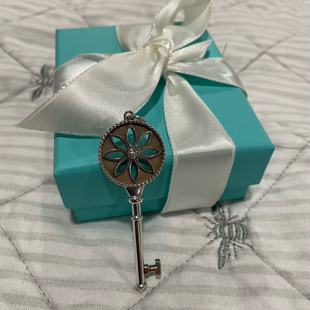 Tiffany & Co. Silver daisy  key charm with diamond